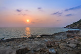 Fototapeta Niebo - Long exposure shot. Sea scape with stone beach at Thailand