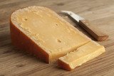 Fototapeta  - Piece of three year old Gouda cheese