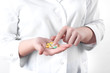 © MestoSveta - pills in the hand of a doctor.