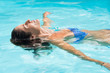 © Rido - Woman relaxing in pool