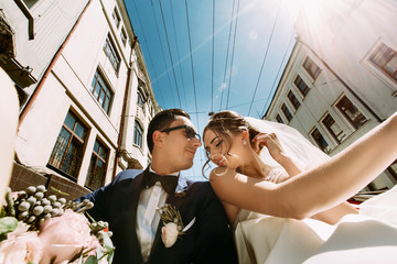 Wall Mural - Lovely modern couple in the small car