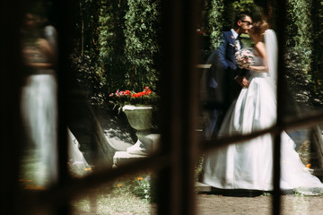 Wall Mural - Reflection of the kiss of the bride and groom