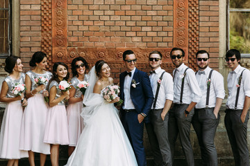 Wall Mural - Charming smiles of the couple with the friends on the wedding