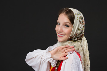 Wall Mural - beautiful  smiling caucasian girl in russian folk costume