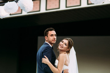 Wall Mural - Joyful first dance of the new wife and husband