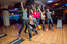 Cheerful Friends At The Bowling Alley