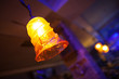 Close-up of orange handmade beautiful lamp in bar.Bokeh