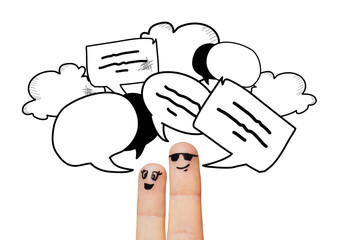 close up of two fingers with communication clouds