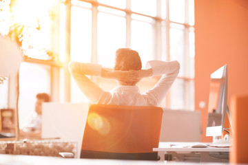 Wall Mural - young business woman relaxing at workplace