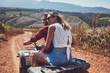 © Jacob Lund - Young happy couple cruising on a quad vehicle