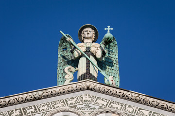 Wall Mural - Blue Eyed Angel Atop an Ornate Church Facade