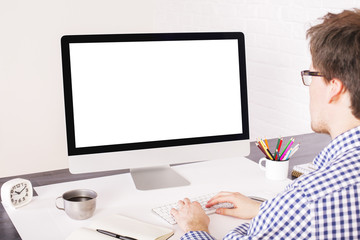 Businessperson typing and looking
