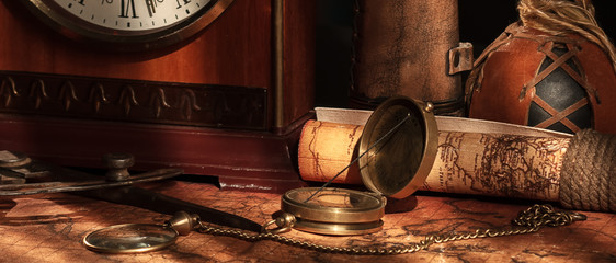 old vintage retro compass on ancient world map. vintage still life. travel geography navigation conc