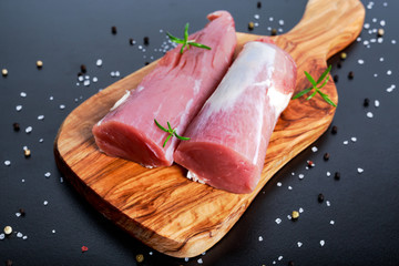 Wall Mural - Fresh Raw pork tenderloin on wooden board .ready to cook