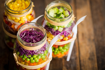 Wall Mural - Fresh vegetable salad in a mason jar