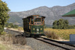 FRANSCHHOEK WESTERN CAPE SOUTH AFRICA. Tourist train at Ricketey Bridge wine estate in the Franschhoek Valley. Passengers pass through the scenic vineyards of this region in the Western Cape