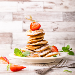 Wall Mural - Dutch mini pancakes called poffertjes