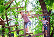 © davit85 - adventure climbing high wire park - people on course in mountain
