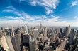 New York City Manhattan midtown aerial panorama view with skyscrapers and blue sky in the day.