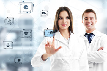 Wall Mural - Two doctors and medicine icons on virtual screen. Medical technology concept