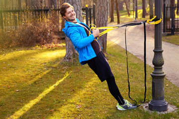 Wall Mural - A man with strips in a park.