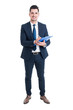 Full body of smiling businessman holding blue clipboard and writ