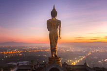 Golden Buddha Statue In Khao Noi Temple At Sunrise Time, Nan Province, Thailand