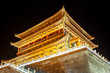 The illuminated ancient Drum Tower located at the ancient city wall by night time, Xian, Shanxi Province, China