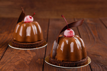 Wall Mural - Chocolate and cherry mousse dessert with glaze