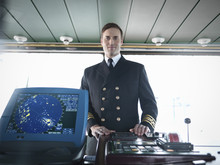 Portrait Of Captain On Bridge Of Ship