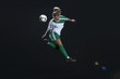© Connect Images - Footballer kicking ball