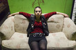 © Connect Images - Portrait of punk girl, sitting on sofa
