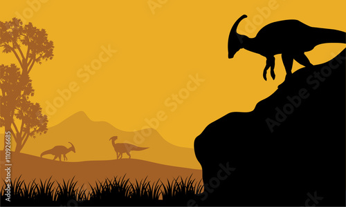 Cuadros en Lienzo At the morning parasaurolophus silhouette in hills