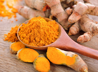 Sticker - Turmeric and turmeric powder on wooden background