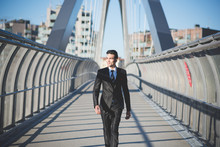 Young Businessman Crossing Bridge