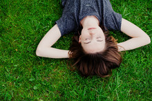 Girl Lying On The Grass