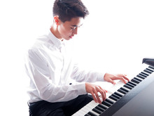 Teenage Boy Playing Piano