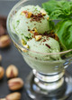 Homemade organic green ice cream - Basil, pistachio, green tea, mint. A refreshing summer dessert. Selective focus
