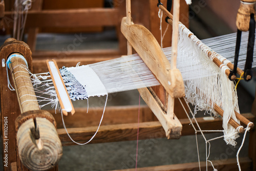 Fotografie, Obraz The production process of the handmade textiles on the loom