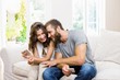 © WavebreakmediaMicro - Smiling young couple looking at mobile phone