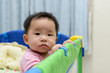 © Kenishirotie - Asian baby in playpen