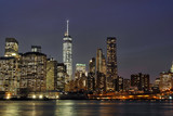 Fototapeta Nowy Jork - Downtown Manhattan at night with the new World Trade Center and East River
