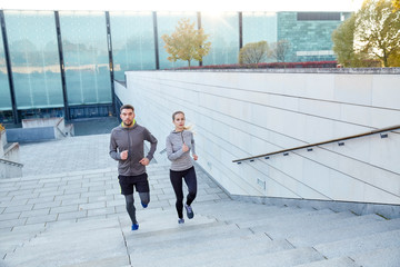 Canvas Print - happy couple running upstairs on city stairs