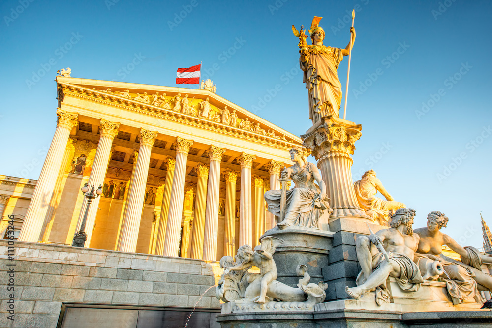 Austrian parliament building with Athena statue on the front in Vienna on the sunrise - obrazy, fototapety, plakaty 