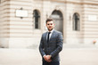 © olegparylyak - Handsome stylish young businessman posing portrait outdoor