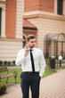 © olegparylyak - Handsome stylish young businessman posing portrait outdoor