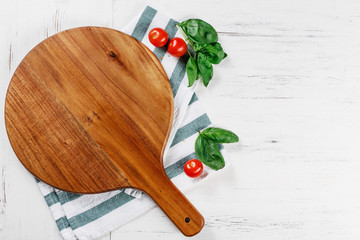 Cutting board for pizza. Traditional italian pizza board. Pizza top view. Great composition for yuor own pizza with copy space. Space for your logo