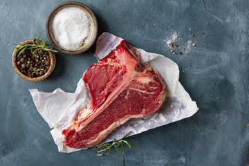 Wall Mural - Thick raw T-bone steak with seasoning