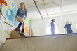 © HEX - Young woman skateboarding at basement skate park