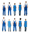 © Andrey Popov - Rear View Of Janitors Standing In Row